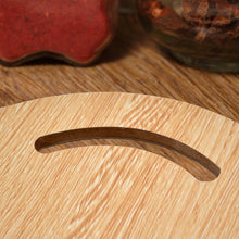 Small round wooden chopping board