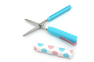 Pen-shaped portable scissors for convenient cutting.