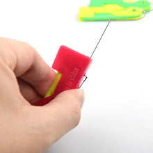 Multicolour automatic needle threading device with a needle inserted