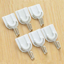 Self-adhesive hook for bathroom or kitchen.