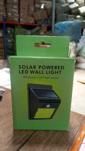 Solar-powered LED security light with sensor.